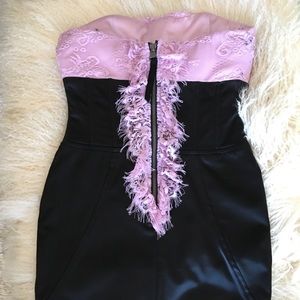 Black satin dress with pink ruffles..